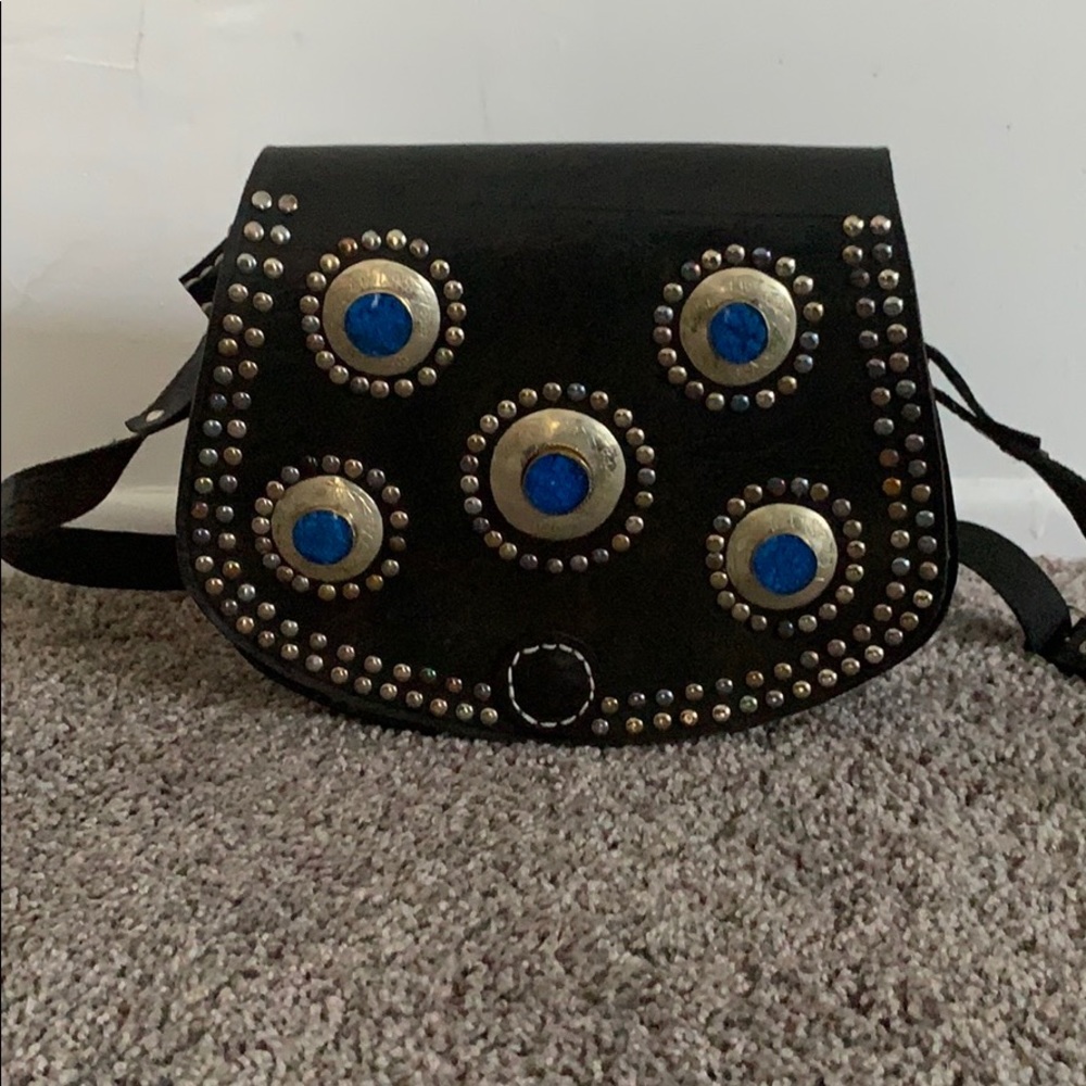 Black leather shoulder bag with blue stones